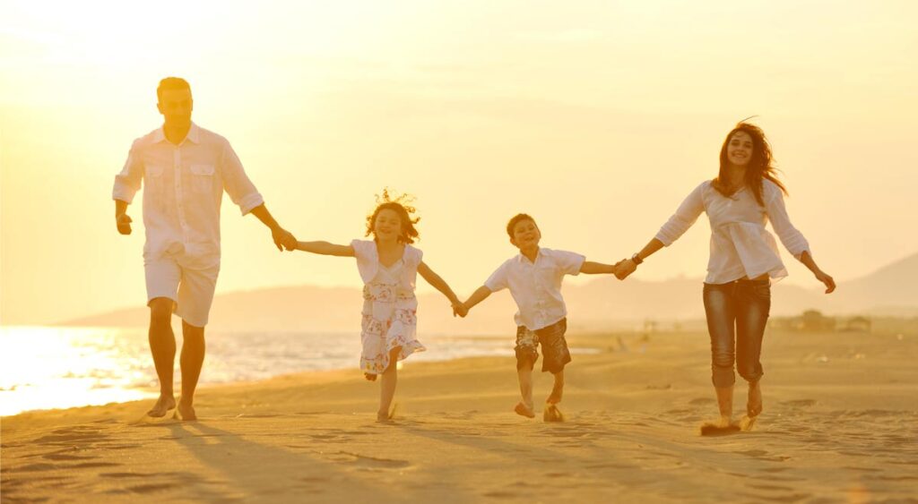 make the most of the remaining days of summer with eNotaryLog - family walking together on a beach